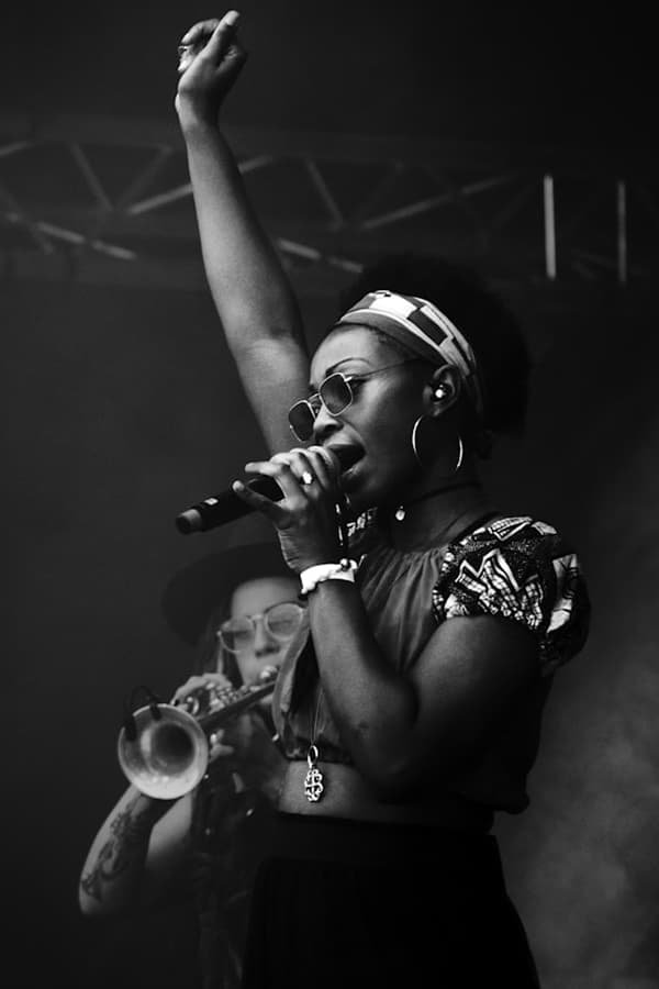 Greyscale-image-of-a-lady-singing-by-Julius-Drost-on-Unsplash